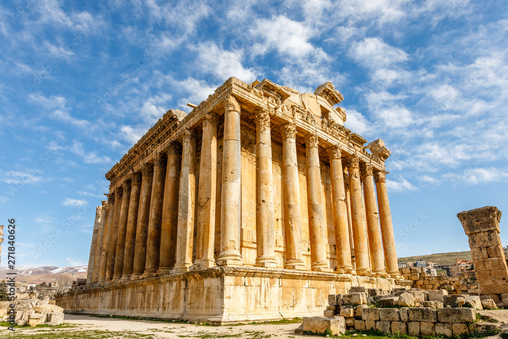 Ancient Roman temple of Bacchus with surrounding ruins and blue sky in the background, Bekaa Valley, Baalbek, Lebanon
