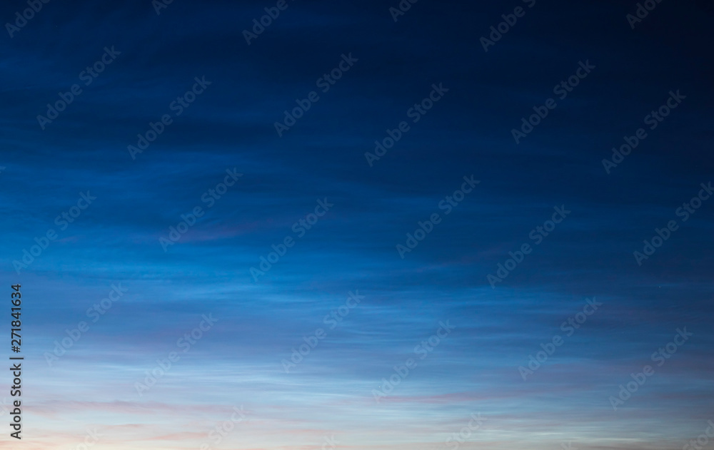 Noctilucent clouds on sunset.