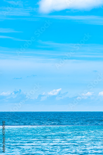 Beautiful outdoor swimming pool in hotel resort with white cloud and blue sky for leisure relax