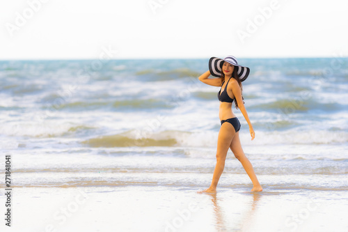 Portrait beautiful young asian woman wear bikini on the beach sea ocean