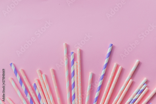 Background for a banner with paper tubes isolated on pink background. Frame for a banner with cocktail tubes. Party Banner  cocktails bar.Elegant White Striped Paper Drinking Straws