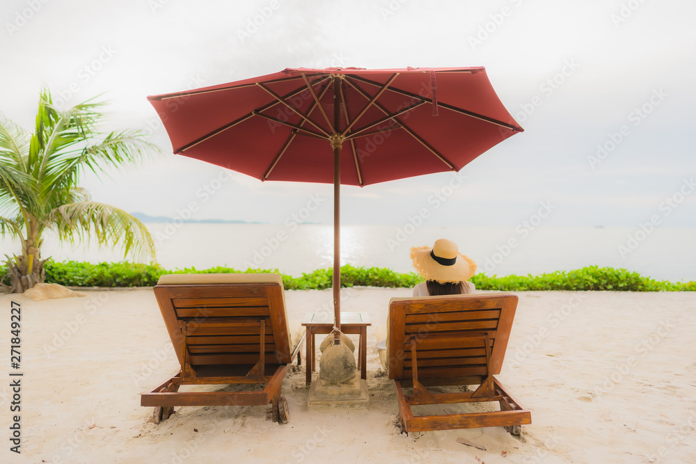 Portrait beautiful asian woman wear hat with smile happy leisure on the beach sea ocean in holiday vacation