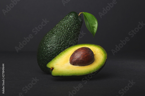 Fresh, raw avocado on a black background