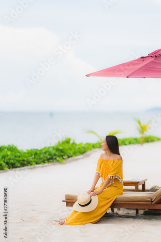 Portrait beautiful asian woman wear hat with smile happy leisure on the beach sea ocean in holiday vacation