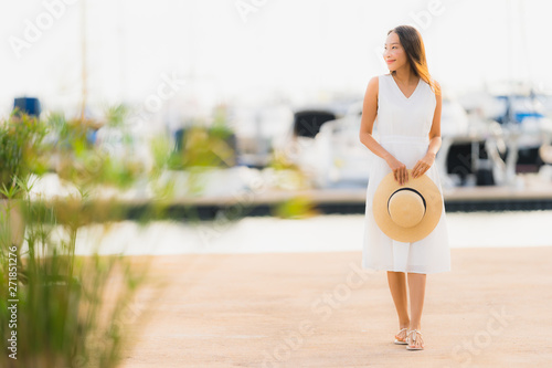 Portrait beautiful young asian woman leisure smile happy relax around yacht port