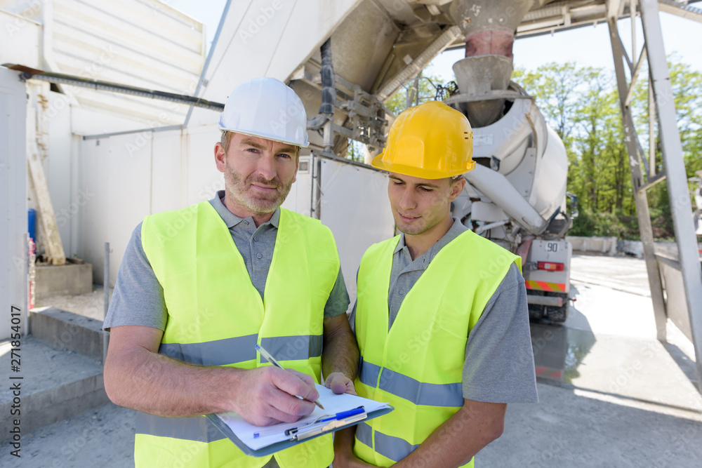 builders talking outdoors builders talking outdoors