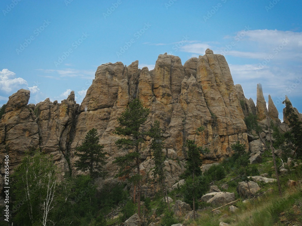 Close up of imposing granite mountains and rock formations along the 14-mile Needles Highway, making the drives an unforgettable experience at Custer State Park, South Dakota.