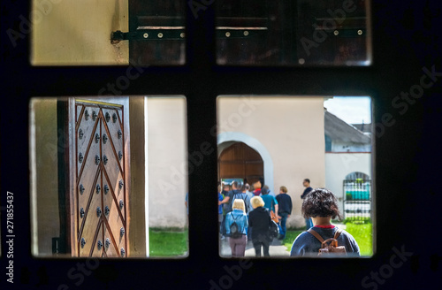 People attend John the Baptist's Church, Halshany village in Grodno region, Belarus.  A Roman Catholic church in Baroque style. Originally built as a part of a Franciscan monastery photo