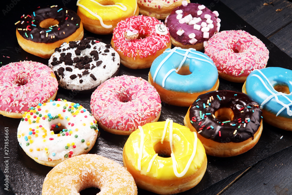 donuts in different glazes with chocolate donuts in different glazes with chocolate