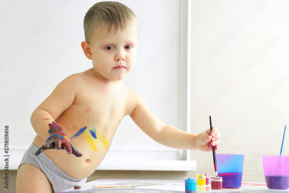 little boy paints paint your hand little boy paints paint your hand