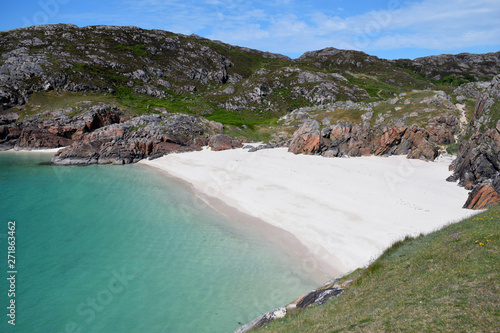 view of the beach with white sand and crystal blue water photography