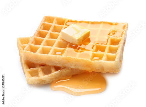 Delicious waffles with butter and honey on white background