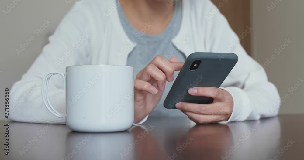 Woman use of cellphone at home
