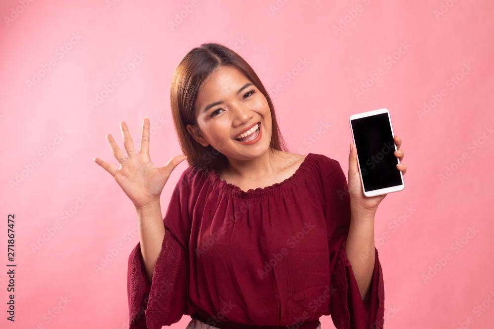 Young Asian woman with mobile phone. Young Asian woman with mobile phone.