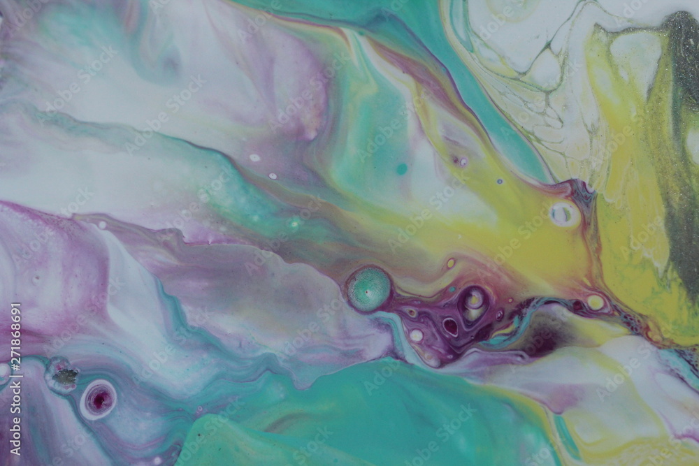 Φωτογραφία Closeup on an abstract acrylic pour painting that is done in yellow, teal, magenta, purple and white that resembles the aurora borealis