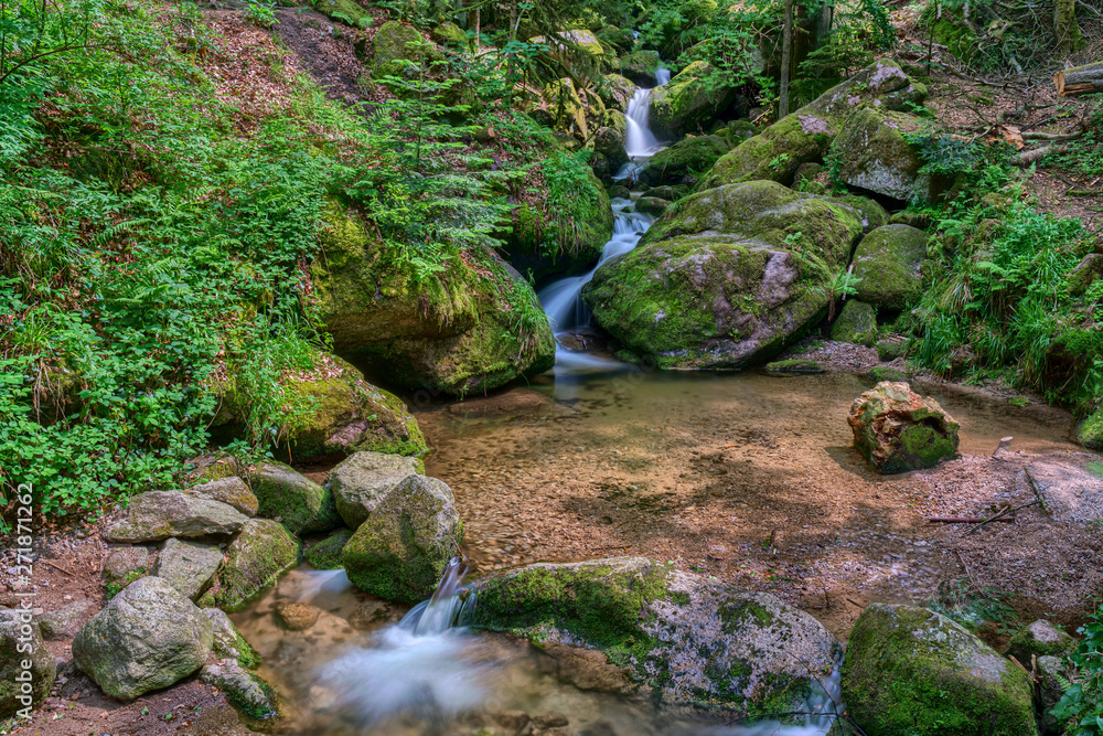 Water streaming over rocky cascades along famous Gertelbach waterfalls, Black Forest, Germany Water streaming over rocky cascades along famous Gertelbach waterfalls, Black Forest, Germany