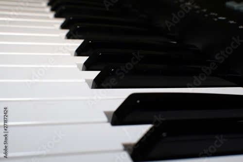 Bild auf Leinwand piano keys on black background, look at the keys of a keyboard