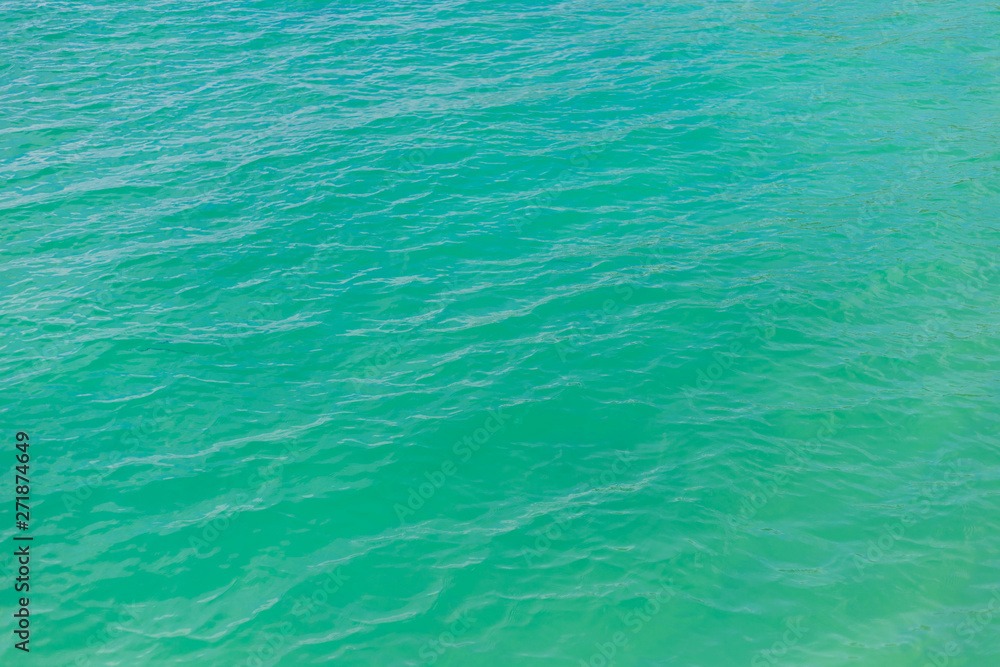 Blue sea water surface texture background.