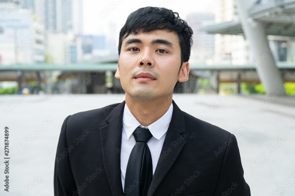 Asian Business man in the formal suit.