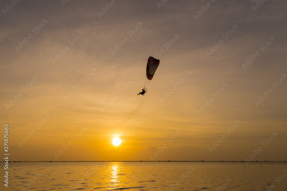 Silhouette of Paramotors flying to sky on sunset. Silhouette of Paramotors flying to sky on sunset.