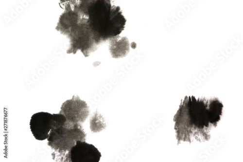 Brush painted black drops on white background