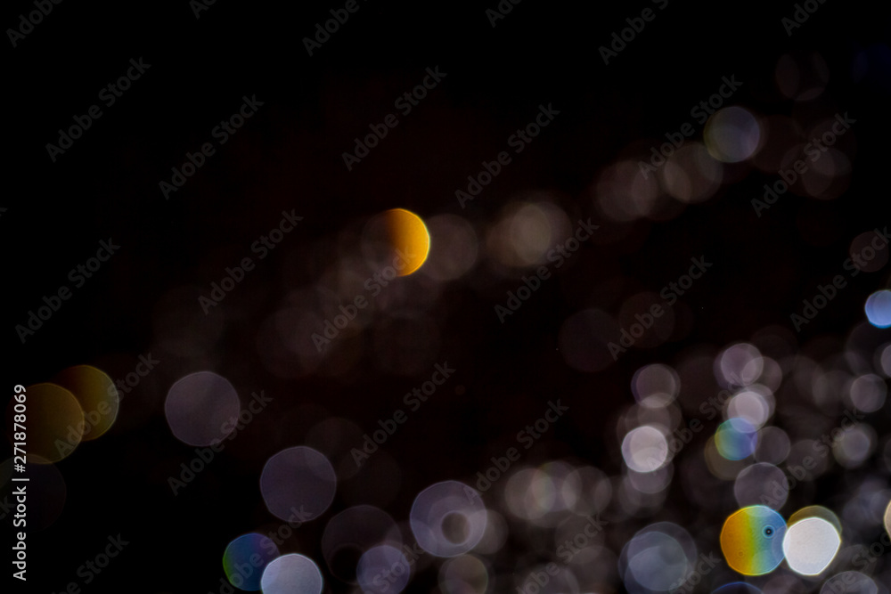 Fototapeta premium Abstract bokeh texture on black