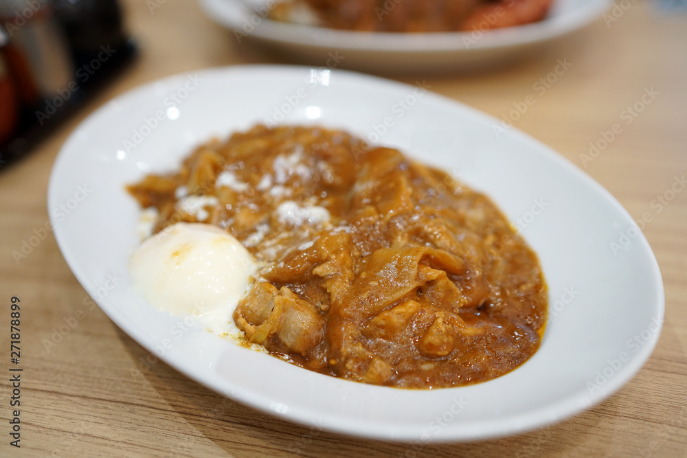 Japanese curry rice with fried pork cutlet and pork sausages. Japanese curry rice with fried pork cutlet and pork sausages.