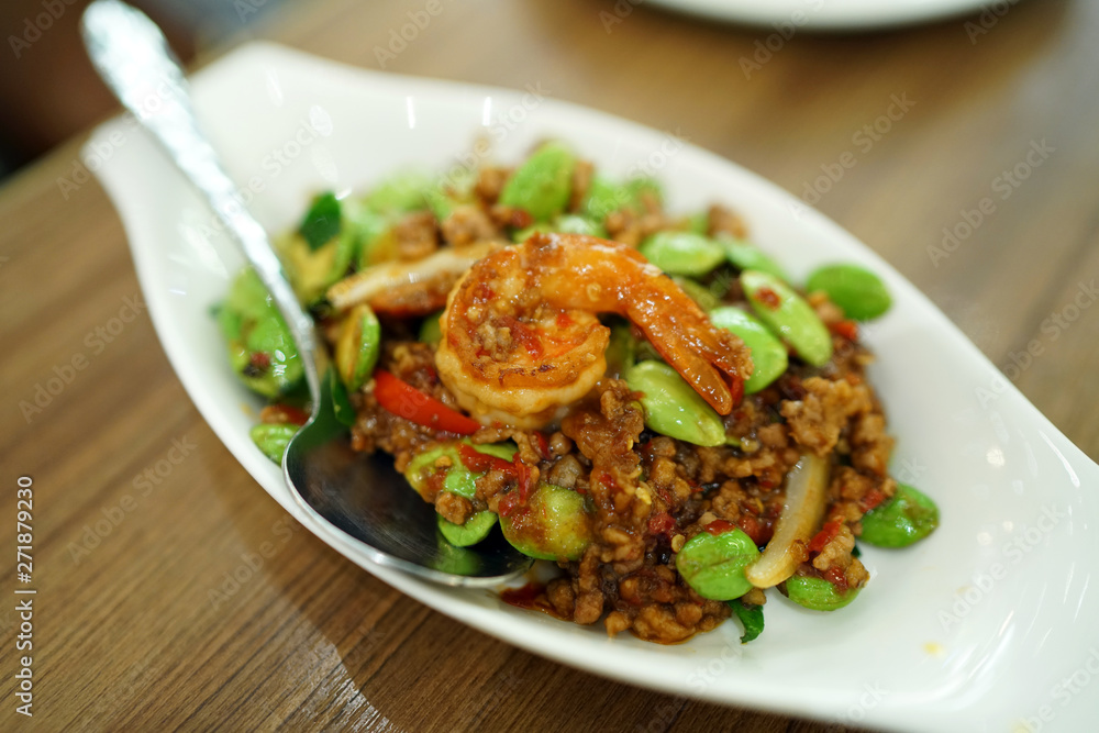 Stir-Fried Twisted cluster bean (Bitter bean or Stink bean) with shrimps paste, Traditional Thai food recipe, Popular in Thailand. Stir-Fried Twisted cluster bean (Bitter bean or Stink bean) with shrimps paste, Traditional Thai food recipe, Popular in Thailand.