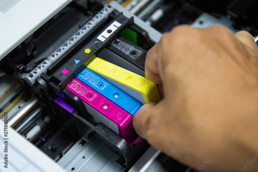 Technicians are installing the color printer inkjet cartridge Technicians are installing the color printer inkjet cartridge