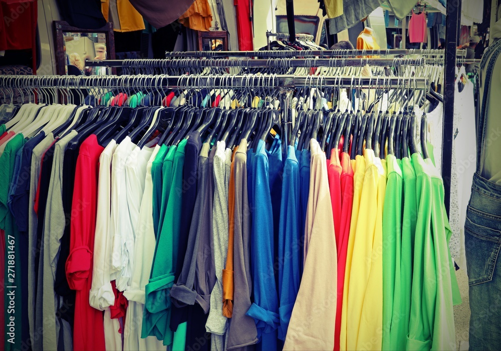 stand of clothes at flea market stand of clothes at flea market