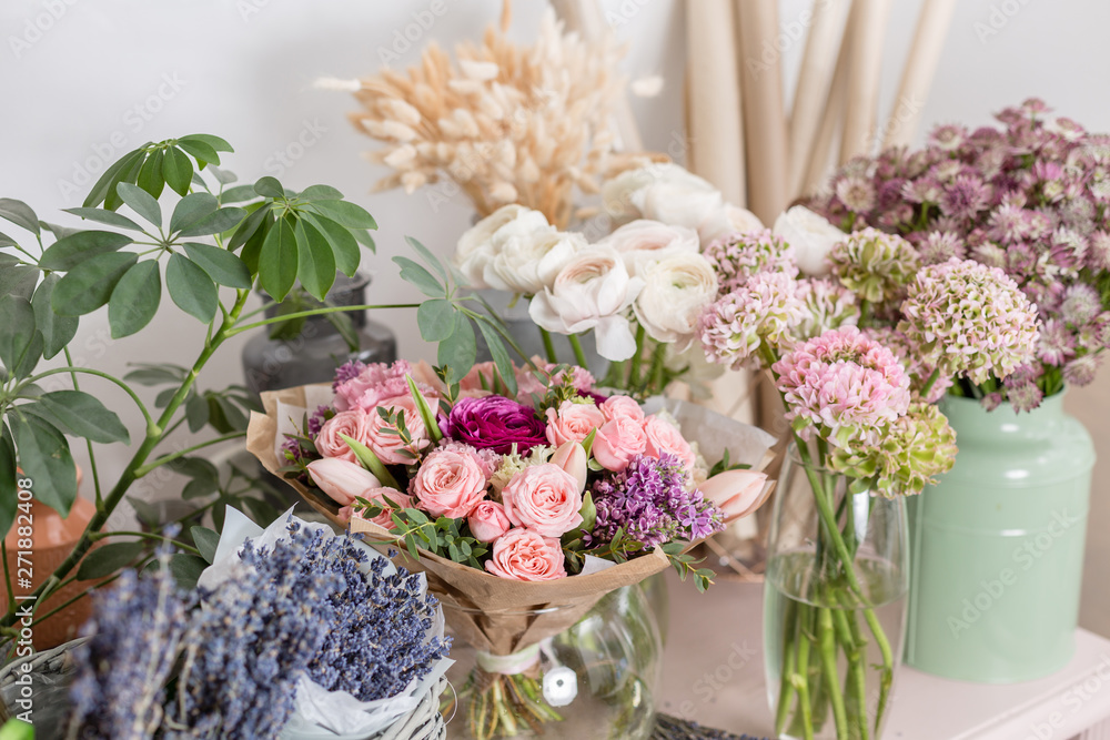 showcase flower shop. Beautiful spring bouquets. Arrangement with mix flowers. Small family business. Work florist. copy space