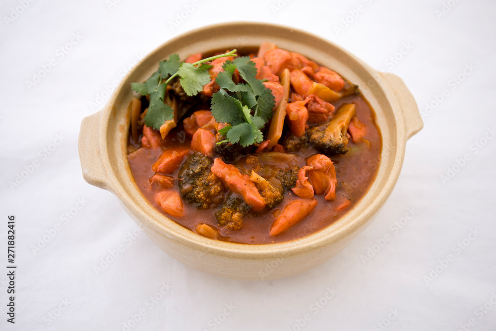 Butter chicken curry with Broccoli in Bowl Butter chicken curry with Broccoli in Bowl