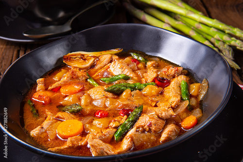 colorful turkey fricassee with asparagus and paprika