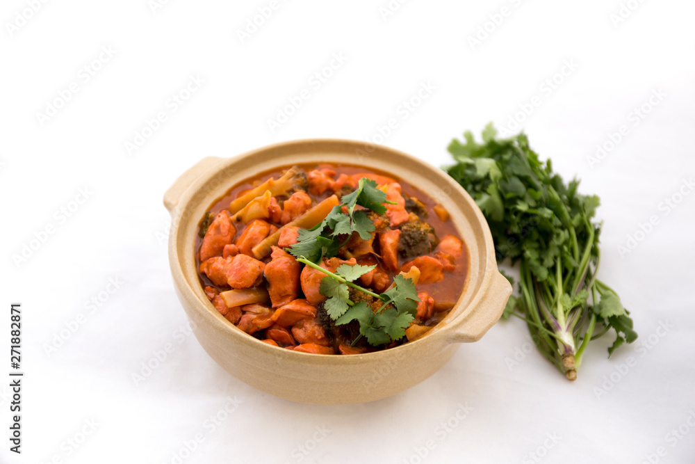 Butter chicken curry with Broccoli in Bowl Butter chicken curry with Broccoli in Bowl