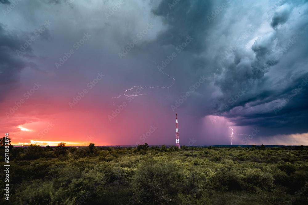 A dramatic storm clouds at sunset