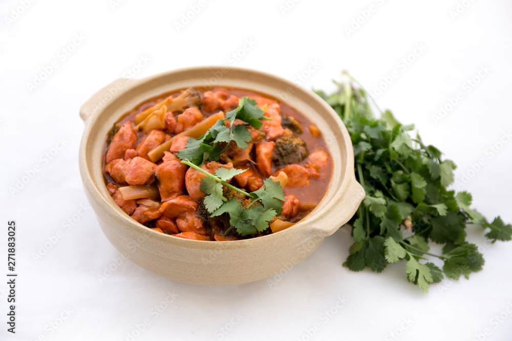 Butter chicken curry with Broccoli in Bowl Butter chicken curry with Broccoli in Bowl