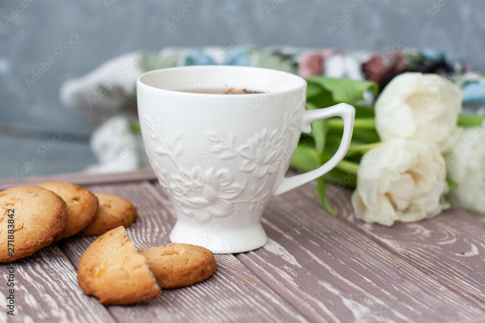 A tasty snack: a cup of tea and a stack of cookies. A tasty snack: a cup of tea and a stack of cookies.