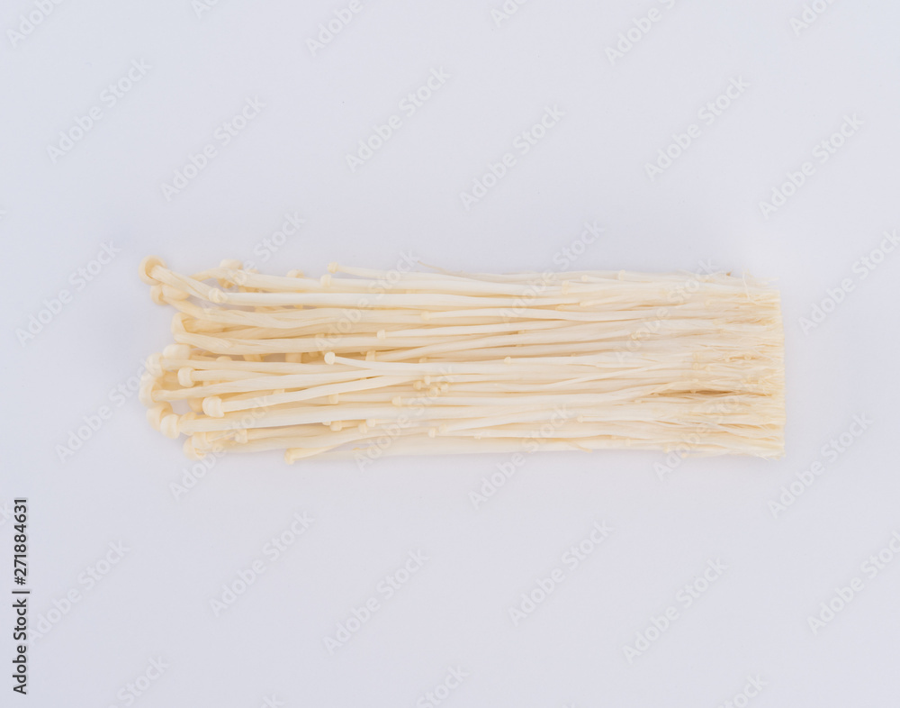 Enokitake or enoki (Flammulina velutipes) white mushroom and also known by the name golden needle mushroom or lily mushroom Enokitake or enoki (Flammulina velutipes) white mushroom and also known by the name golden needle mushroom or lily mushroom