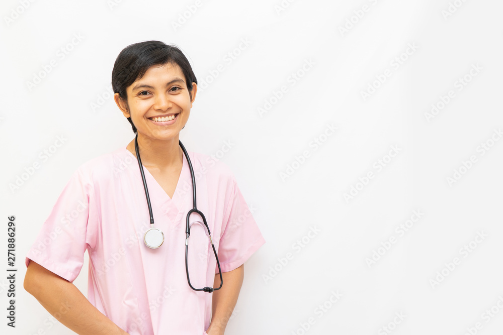 Asian female doctor with shot black hair wearing pink uniform and has stethoscope on shoulder. Confident, friendly and warmth looks isolated in white background. Space for text Asian female doctor with shot black hair wearing pink uniform and has stethoscope on shoulder. Confident, friendly and warmth looks isolated in white background. Space for text