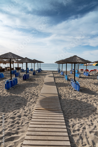 Umbrellas on Kardamena city beach in Kos island  Greece.