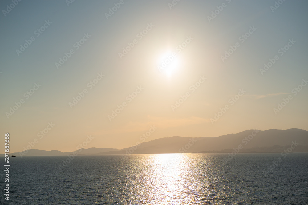 Beautiful anoramic view of Mediterranean sea, sky and sun at silver sunset in Palma de Mallorca, Spain.