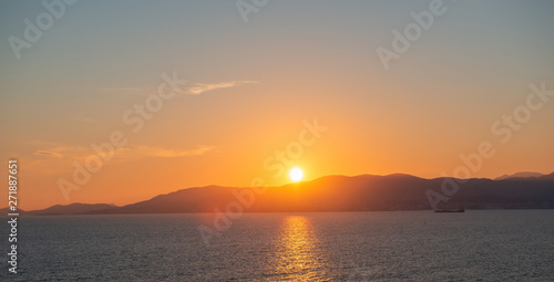 Panoramic view of Mediterranean sea  sky and sun at sunset in Palma de Mallorca  Spain.