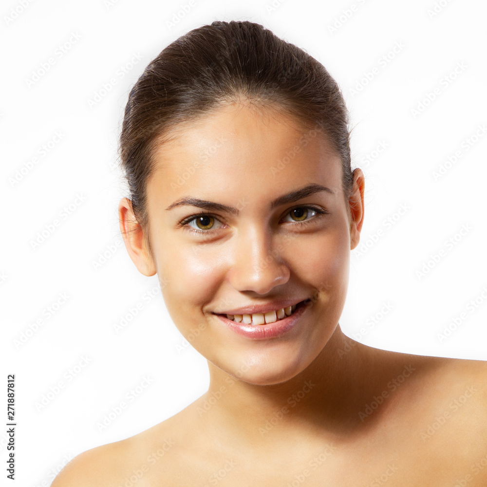 Beauty feminine portrait of female face with healthy natural skin. Beautiful tanned teen girl looking at camera and happy smiling. Pretty attractive young woman posing at studio, isolated on white Beauty feminine portrait of female face with healthy natural skin. Beautiful tanned teen girl looking at camera and happy smiling. Pretty attractive young woman posing at studio, isolated on white