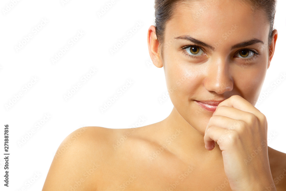 Beauty feminine portrait of female face with healthy natural skin. Beautiful tanned teen girl looking at camera. Pretty attractive young woman posing at studio, isolated on white Beauty feminine portrait of female face with healthy natural skin. Beautiful tanned teen girl looking at camera. Pretty attractive young woman posing at studio, isolated on white