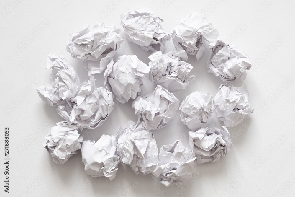 Waste recycling. Flat lay of crumpled paper ball pile on white surface. Abstract background. Waste recycling. Flat lay of crumpled paper ball pile on white surface. Abstract background.