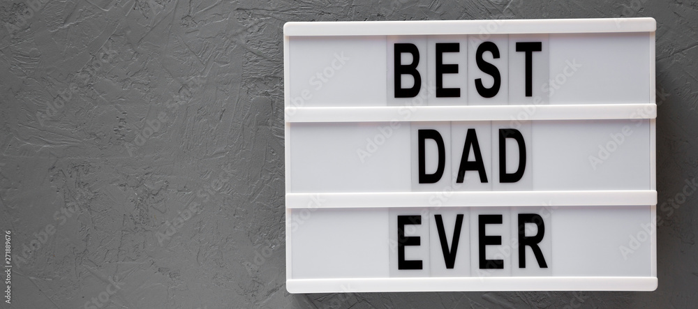 Lightbox with 'Best dad ever' words over gray surface, top view. Overhead, from above, flat lay. Copy space. Lightbox with 'Best dad ever' words over gray surface, top view. Overhead, from above, flat lay. Copy space.