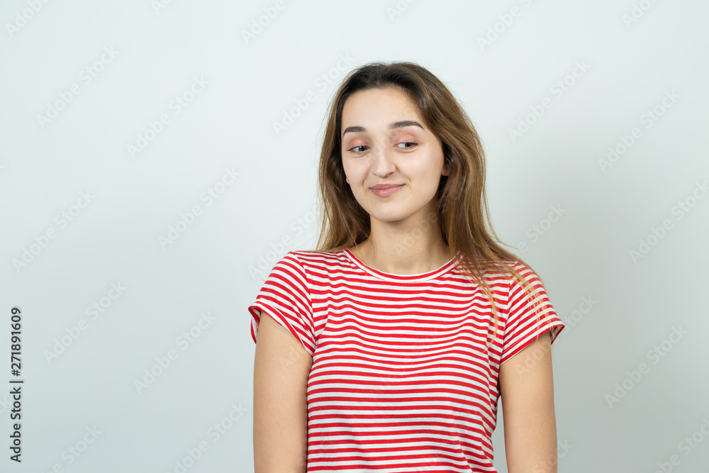 Emotional portrait of a fair-haired girl on a gray background, stormy emotions, business concept. Emotional portrait of a fair-haired girl on a gray background, stormy emotions, business concept.