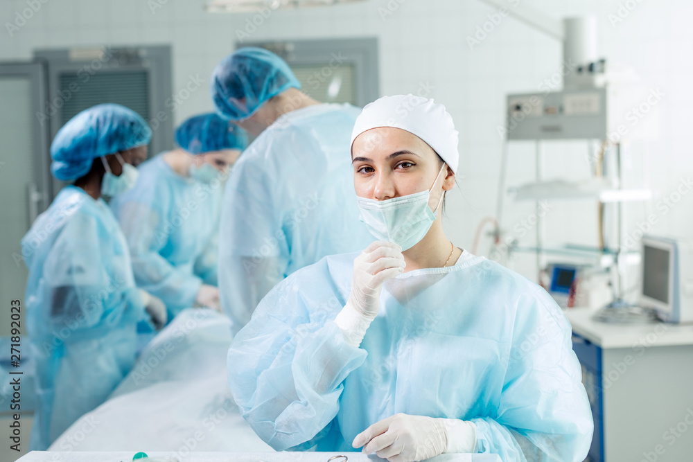 Young tired nurse in cap taking off face mask. close up photo.job, occupation concept Young tired nurse in cap taking off face mask. close up photo.job, occupation concept