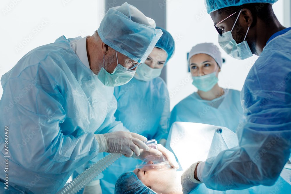 oxygen therapy concept.doctors using oxygen mask and endotrachea catheter during the surgery. close up photo oxygen therapy concept.doctors using oxygen mask and endotrachea catheter during the surgery. close up photo