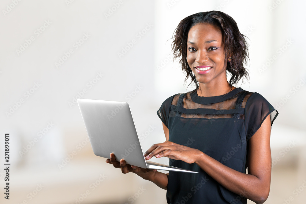 Portrait of confident young african woman using laptop Portrait of confident young african woman using laptop